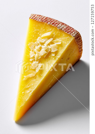 Slice of pecorino cheese with textured surface displayed against white background. Focus on vibrant yellow color, inviting culinary creativity Slice of pecorino cheese with textured surface displayed against white background. Focus on vibrant yellow color, inviting culinary creativity 127159753