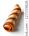 Flaky pastry roll lies on clean white surface, showcasing its crispy texture and golden layers. This minimalist aesthetic highlights culinary artistry, ideal for bakery, catering, dessert shop 127159826