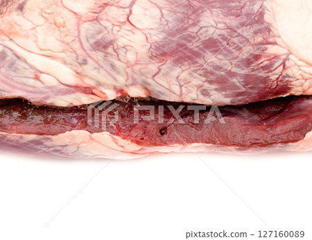 Raw frozen beef heart. 127160089
