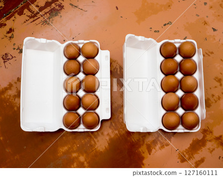 Chicken Eggs in a plastic tray. 127160111