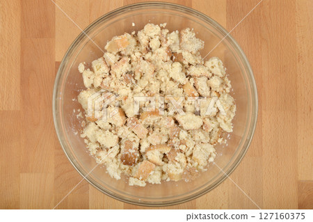 Moistened, crumbled stale bread Moistened, crumbled stale bread 127160375