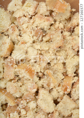 Moistened, crumbled stale bread Moistened, crumbled stale bread 127160377