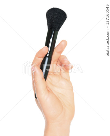Woman hand holds black cosmetics brush, isolated on transparent background, cosmetics and visage concept Woman hand holds black cosmetics brush, isolated on transparent background, cosmetics and visage concept 127160549