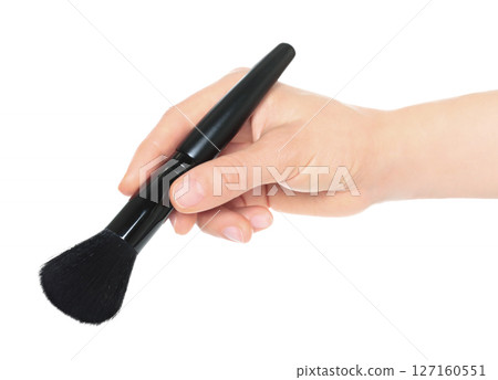 Woman hand holds black cosmetics brush, isolated on transparent background, cosmetics and visage concept Woman hand holds black cosmetics brush, isolated on transparent background, cosmetics and visage concept 127160551
