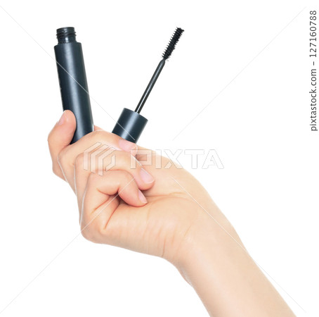 Woman hand holds cosmetic mascara brush, isolated on transparent background, cosmetics and visage concept Woman hand holds cosmetic mascara brush, isolated on transparent background, cosmetics and visage concept 127160788