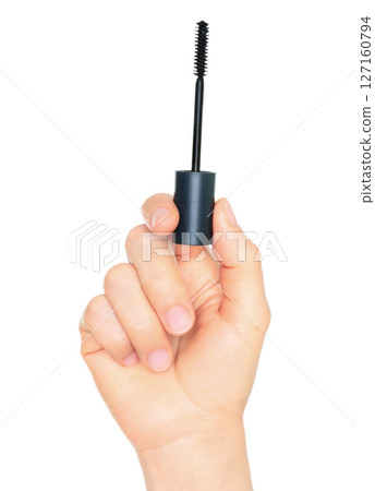 Woman hand holds cosmetic mascara brush, isolated on transparent background, cosmetics and visage concept 127160794