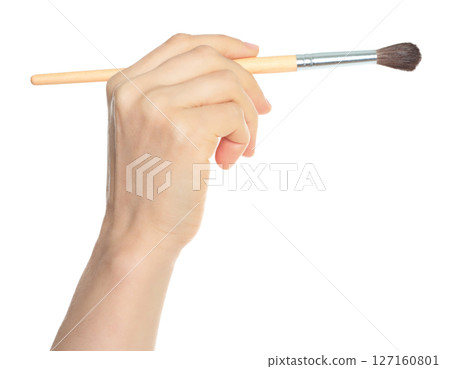 Woman hand holds paint brush, isolated on transparent background, painting and design concept Woman hand holds paint brush, isolated on transparent background, painting and design concept 127160801