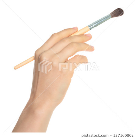 Woman hand holds paint brush, isolated on transparent background, painting and design concept 127160802