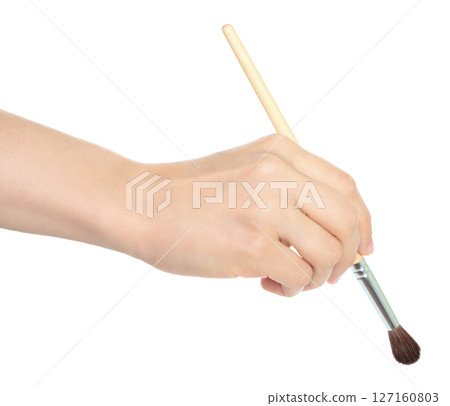 Woman hand holds paint brush, isolated on transparent background, painting and design concept Woman hand holds paint brush, isolated on transparent background, painting and design concept 127160803