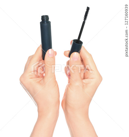 Woman hand holds cosmetic mascara brush, isolated on transparent background, cosmetics and visage concept Woman hand holds cosmetic mascara brush, isolated on transparent background, cosmetics and visage concept 127160939