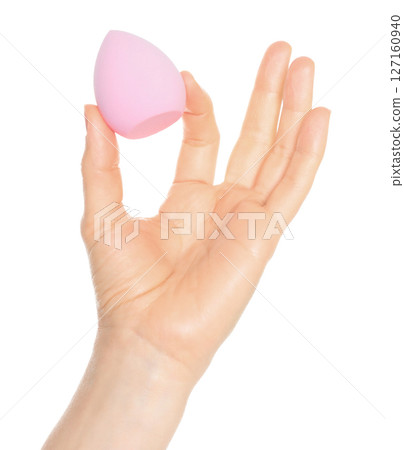 Woman Hand holds a cosmetic sponge, isolated on transparent background close-up, template for cosmetics ads Woman Hand holds a cosmetic sponge, isolated on transparent background close-up, template for cosmetics ads 127160940