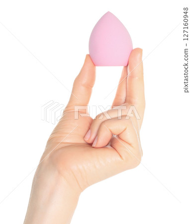 Woman Hand holds a cosmetic sponge, isolated on transparent background close-up, template for cosmetics ads 127160948