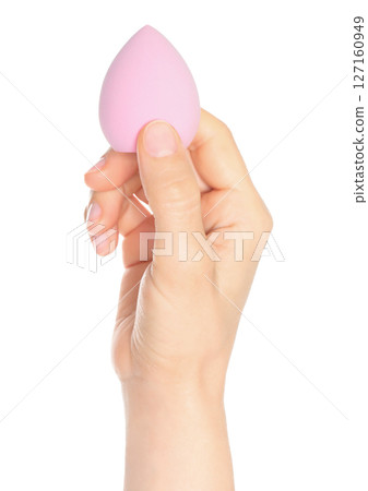 Woman Hand holds a cosmetic sponge, isolated on transparent background close-up, template for cosmetics ads Woman Hand holds a cosmetic sponge, isolated on transparent background close-up, template for cosmetics ads 127160949