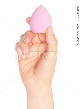 Woman Hand holds a cosmetic sponge, isolated on transparent background close-up, template for cosmetics ads Woman Hand holds a cosmetic sponge, isolated on transparent background close-up, template for cosmetics ads 127160950