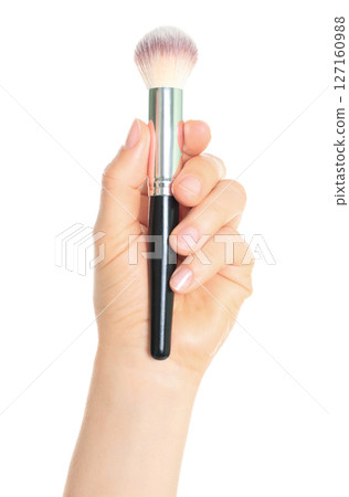 Woman hand holds black cosmetics brush, isolated on transparent background, cosmetics and visage concept Woman hand holds black cosmetics brush, isolated on transparent background, cosmetics and visage concept 127160988