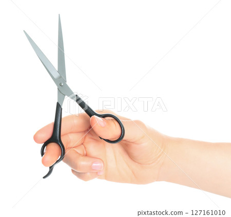 Woman hand holds Office Scissors, isolated on transparent background, stationery concept Woman hand holds Office Scissors, isolated on transparent background, stationery concept 127161010