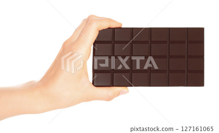 Woman hand holds a chocolate bar, isolated on transparent background, sweet food concept 127161065