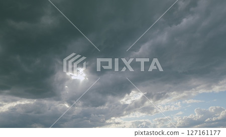 Witnessing a Dramatic, Overcast Cloudy Sky Accompanied by Beautiful Hints of Sunlight Witnessing a Dramatic, Overcast Cloudy Sky Accompanied by Beautiful Hints of Sunlight 127161177