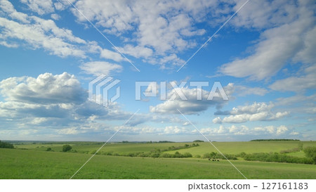 Beautiful Serene Landscapes Showcasing Blue Skies Alongside Vibrant Green Fields Beautiful Serene Landscapes Showcasing Blue Skies Alongside Vibrant Green Fields 127161183