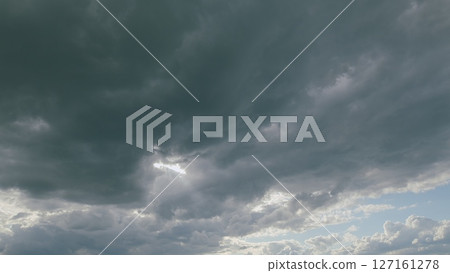 An Incredible and Dramatic Cloud Formation with Intermittent Rays of Sunlight Peeking Through An Incredible and Dramatic Cloud Formation with Intermittent Rays of Sunlight Peeking Through 127161278