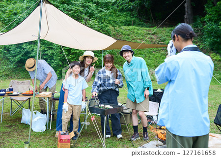 3 generations camping outdoor barbecue BBQ family colleagues friends 127161658