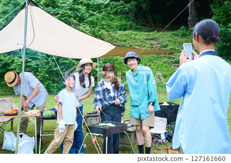 3 generations camping outdoor barbecue BBQ family colleagues friends 127161660