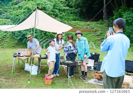 3 generations camping outdoor barbecue BBQ family colleagues friends 127161663