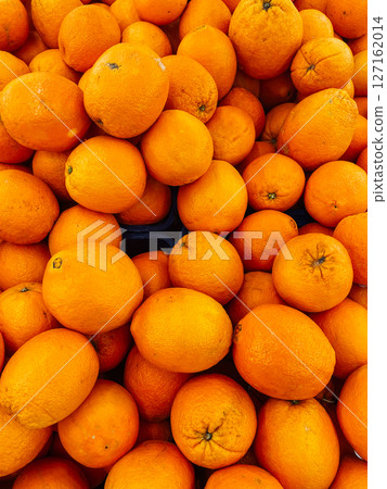 lots of orange fruits for food as background lots of orange fruits for food as background 127162014
