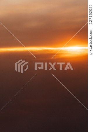 landscape on the sunset sky with clouds from the airplane window landscape on the sunset sky with clouds from the airplane window 127162033