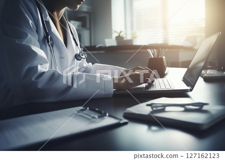 Doctor working in medical field working on computer 127162123