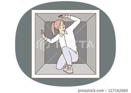 Discouraged woman is trapped sitting in small box experiencing claustrophobia and repressed emotions 127162660