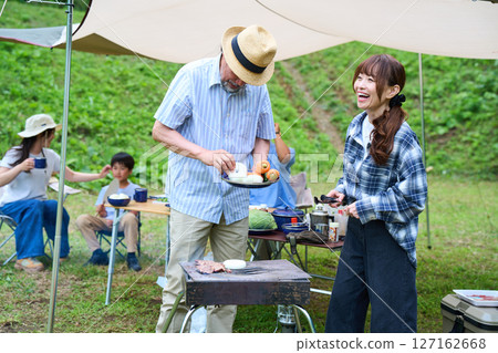 3 generations camping outdoor barbecue BBQ family colleagues friends 3 generations camping outdoor barbecue BBQ family colleagues friends 127162668