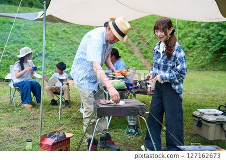 3 generations camping outdoor barbecue BBQ family colleagues friends 3 generations camping outdoor barbecue BBQ family colleagues friends 127162673