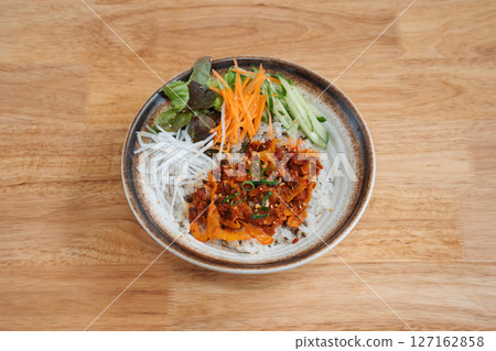 asian fusion rice dish with vegetables. Delicious freshly prepared meal, perfect for menus, restaurants, or food delivery concepts. asian fusion rice dish with vegetables. Delicious freshly prepared meal, perfect for menus, restaurants, or food delivery concepts. 127162858