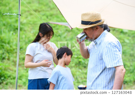 3 generations camping outdoor barbecue BBQ family colleagues friends 3 generations camping outdoor barbecue BBQ family colleagues friends 127163048