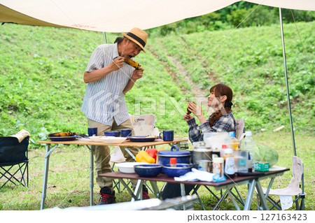 Senior couple camping outdoor barbecue BBQ family 127163423
