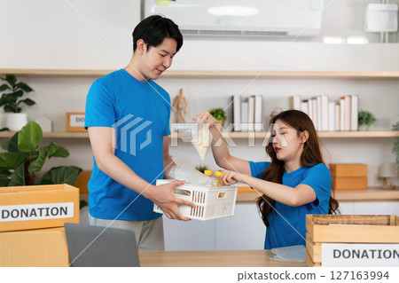 Food Donation Collaboration. Volunteers working together for community welfare. 127163994