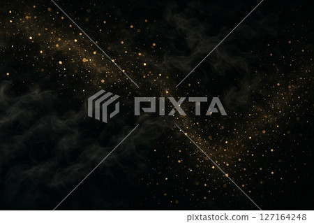 Gold powder and steam flying on a black background (food background) 127164248