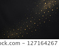 Gold powder dancing on a black background (food background) 127164267