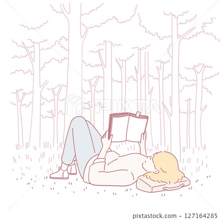 A Woman Engaged in Reading a Book in a Calm and Serene Forest Setting Surrounded by Nature 127164285