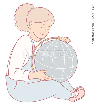 A Cute Young Girl Happily Embracing a Globe, Signifying her Curiosity and Enthusiasm 127164373