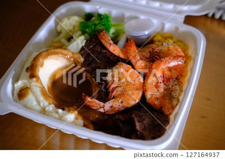 Garlic shrimp and steak takeout Garlic shrimp and steak takeout 127164937