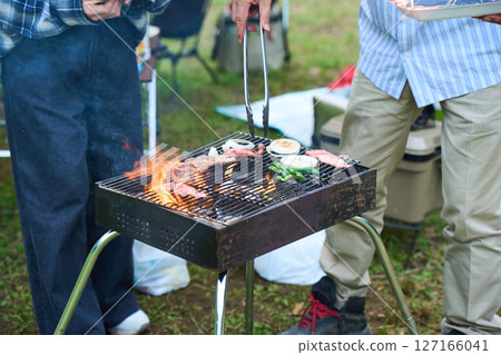 Camping, outdoor, barbecue, BBQ, grilled meat, charcoal fire 127166041