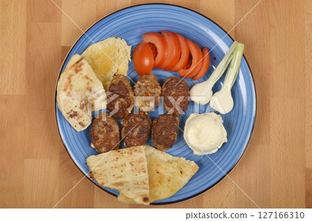 Savory minced meat and cheese patties 127166310