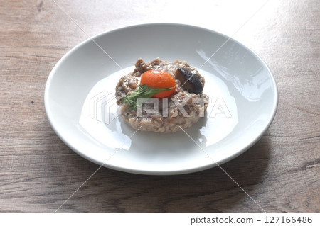 steamed chop pork topping salty egg yolk with black mushroom in gravy sauce on plate steamed chop pork topping salty egg yolk with black mushroom in gravy sauce on plate 127166486