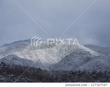 Snowy mountain scenery in the Japanese countryside in winter Snowy mountain scenery in the Japanese countryside in winter 127167587