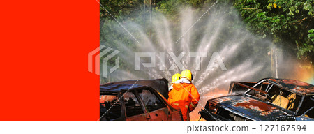 Firefighter Rescue training in fire fighting extinguisher. Firefighter fighting with flame using fire hose chemical water foam spray engine. Fireman wear hard hat, safety suit uniform for protection 127167594