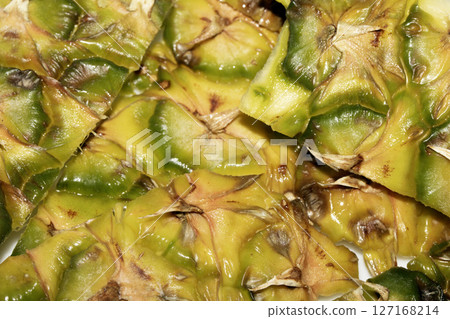 Close up of pieapple fruit skin on white background 127168214