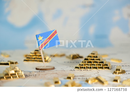 Democratic Republic of Congo flag on a global map, surrounded by many glistening gold bars, signifying national wealth, mineral resources, and economic power 127168738