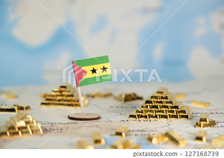Sao Tome and Principe flag with shiny gold bars on a world map, symbolizing national wealth, resource potential, global investment, and financial opportunities, with copy space 127168739